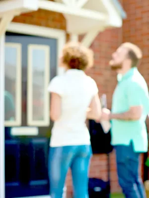 couple outside house
